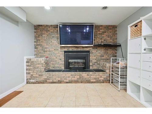 9 Cronquist Close, Red Deer, AB - Indoor Photo Showing Other Room With Fireplace