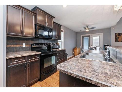 70 Morton Close, Penhold, AB - Indoor Photo Showing Kitchen With Double Sink