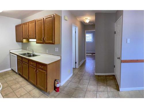 5916 55 Avenue, Red Deer, AB - Indoor Photo Showing Kitchen With Double Sink
