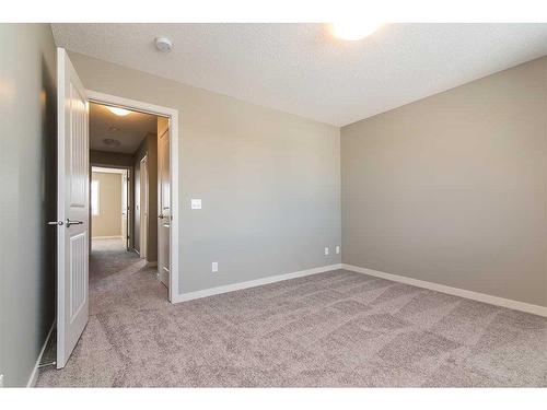 20 Emberside Grove, Cochrane, AB - Indoor Photo Showing Other Room