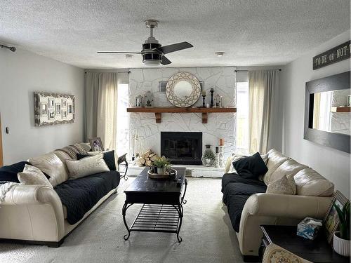 574 Crescent West, Forestburg, AB - Indoor Photo Showing Living Room With Fireplace