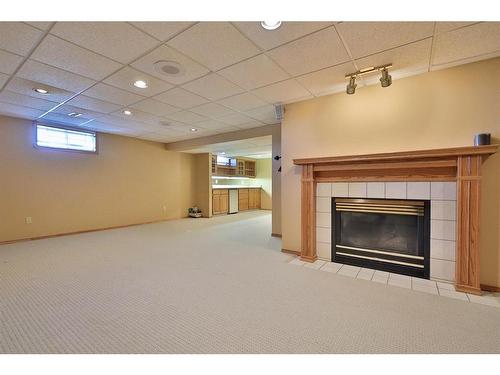 5215 67 Street, Ponoka, AB - Indoor Photo Showing Basement With Fireplace