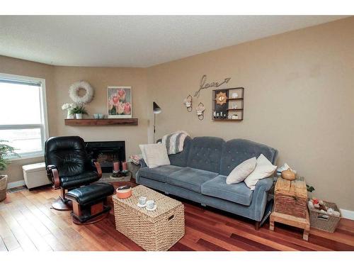 79-31 Alford Avenue, Red Deer, AB - Indoor Photo Showing Living Room With Fireplace