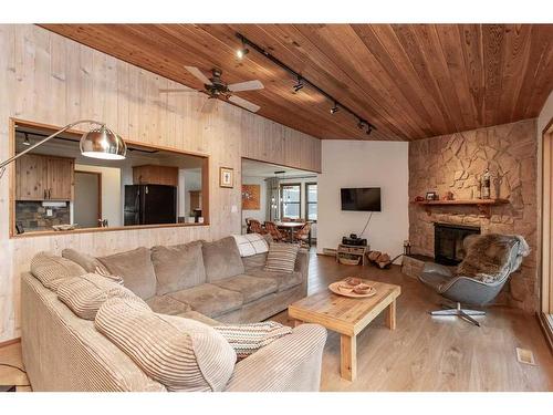 35 Lakeview Drive, Rural Ponoka County, AB - Indoor Photo Showing Living Room With Fireplace