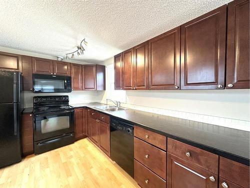 4804D 54 Avenue, Camrose, AB - Indoor Photo Showing Kitchen With Double Sink