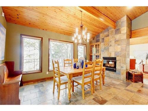 138-36240 Range Road 250, Rural Red Deer County, AB - Indoor Photo Showing Dining Room With Fireplace