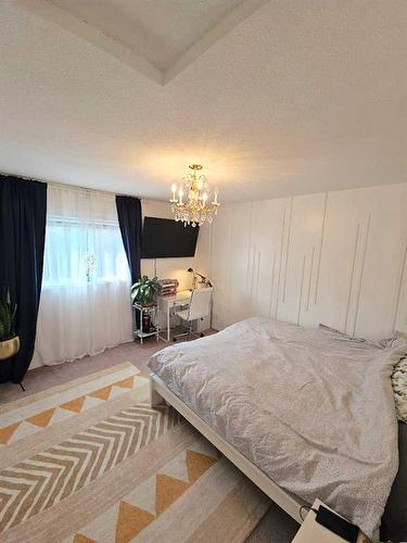 17 Westwood Court, Sylvan Lake, AB - Indoor Photo Showing Bedroom