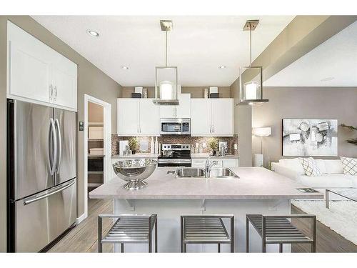 15 Legacy Close Se, Calgary, AB - Indoor Photo Showing Kitchen With Stainless Steel Kitchen With Upgraded Kitchen