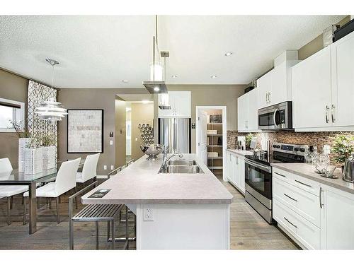 15 Legacy Close Se, Calgary, AB - Indoor Photo Showing Kitchen With Double Sink With Upgraded Kitchen