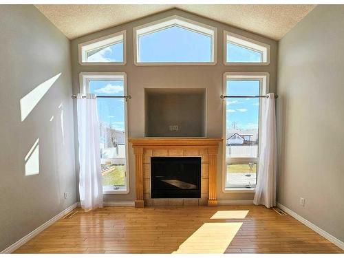 609 11 Avenue Sw, Slave Lake, AB - Indoor Photo Showing Living Room With Fireplace