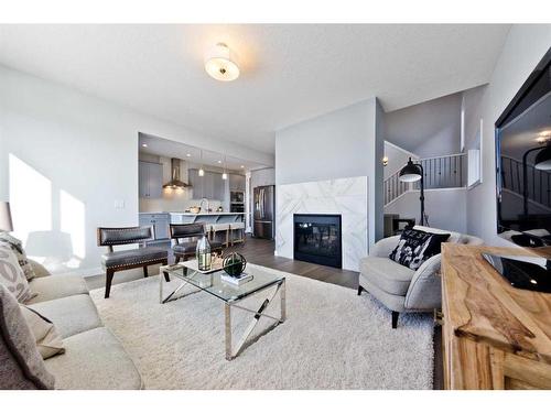 43 Versant View Sw, Calgary, AB - Indoor Photo Showing Living Room With Fireplace