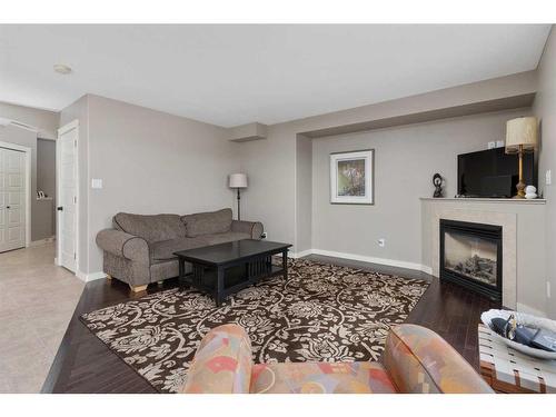 4317 71 Street Close, Camrose, AB - Indoor Photo Showing Living Room With Fireplace