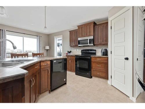 4317 71 Street Close, Camrose, AB - Indoor Photo Showing Kitchen With Double Sink