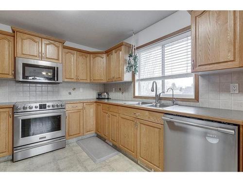 16 Elizabeth Park Boulevard, Lacombe, AB - Indoor Photo Showing Kitchen With Stainless Steel Kitchen With Double Sink