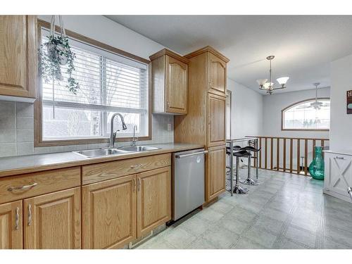 16 Elizabeth Park Boulevard, Lacombe, AB - Indoor Photo Showing Kitchen With Double Sink