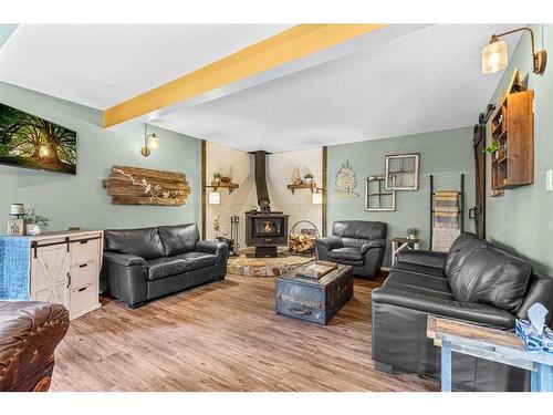 4808 64 Street, Rocky Mountain House, AB - Indoor Photo Showing Living Room With Fireplace