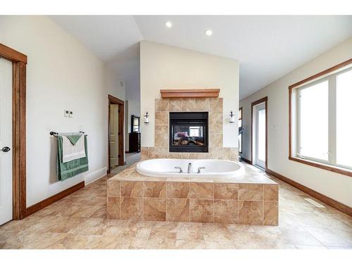 7028 Cobb Street, Lacombe, AB - Indoor Photo Showing Bathroom With Fireplace