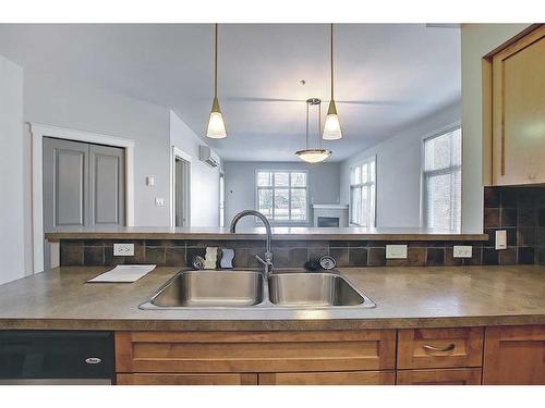 101-100 Lakeway, Sylvan Lake, AB - Indoor Photo Showing Kitchen With Double Sink
