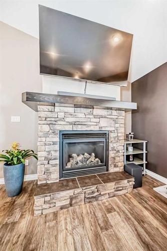 433014B Range Road 11, Rural Ponoka County, AB - Indoor Photo Showing Living Room With Fireplace