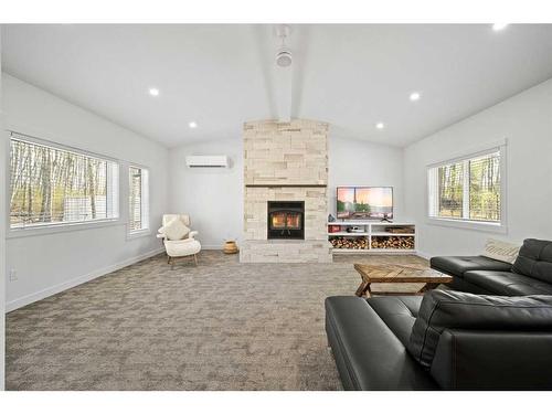 36-423002 Range Road 10, Rural Ponoka County, AB - Indoor Photo Showing Living Room With Fireplace