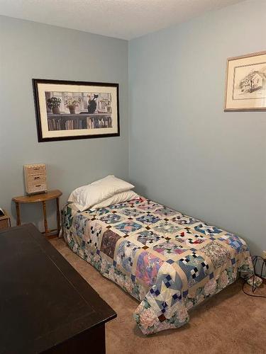 4616 48A Avenue, Sylvan Lake, AB - Indoor Photo Showing Bedroom