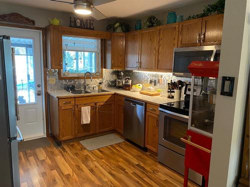 4616 48A Avenue, Sylvan Lake, AB - Indoor Photo Showing Kitchen With Double Sink