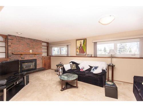 3501 39 Street, Red Deer, AB - Indoor Photo Showing Living Room With Fireplace