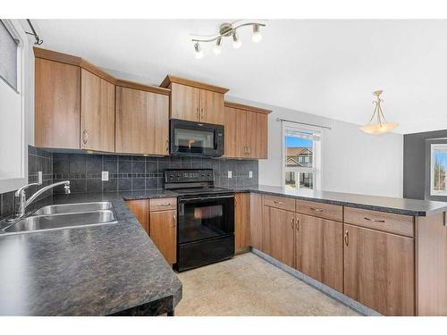 96 Bowman Circle, Sylvan Lake, AB - Indoor Photo Showing Kitchen With Double Sink