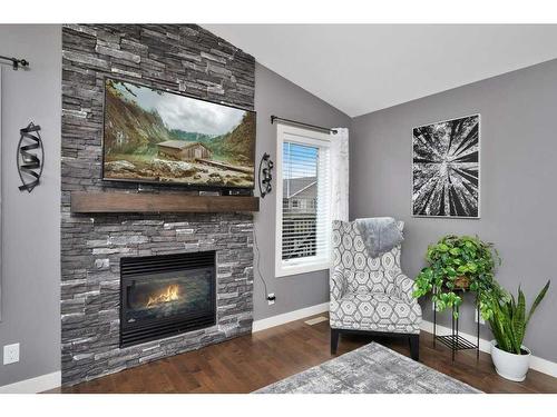 79 Voisin Close, Red Deer, AB - Indoor Photo Showing Living Room With Fireplace