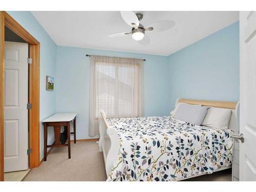 101 Old Boomer Road, Sylvan Lake, AB - Indoor Photo Showing Bedroom