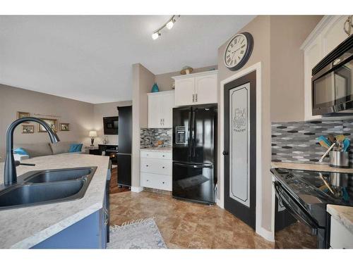 64 Jarvis Avenue, Red Deer, AB - Indoor Photo Showing Kitchen With Double Sink