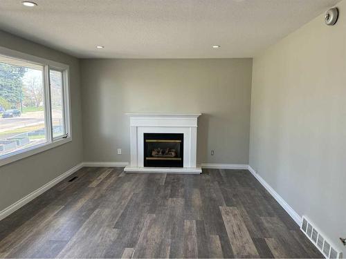 4110 37 Avenue, Red Deer, AB - Indoor Photo Showing Living Room With Fireplace