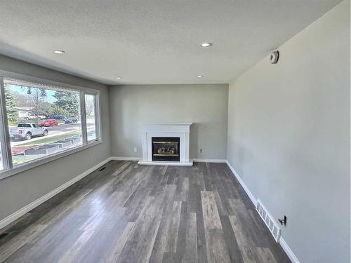 4110 37 Avenue, Red Deer, AB - Indoor Photo Showing Living Room With Fireplace