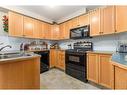217-260 Duston Street, Red Deer, AB  - Indoor Photo Showing Kitchen With Double Sink 