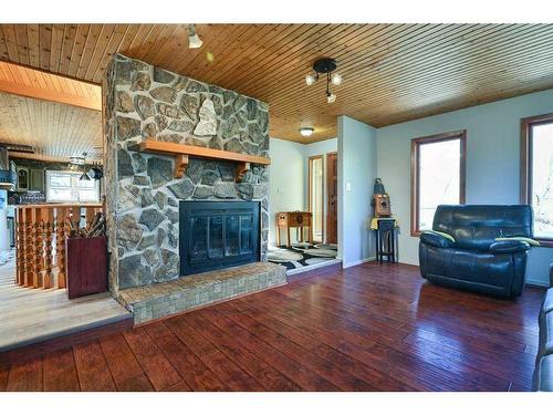 24027 Highway 595, Rural Red Deer County, AB - Indoor Photo Showing Living Room With Fireplace
