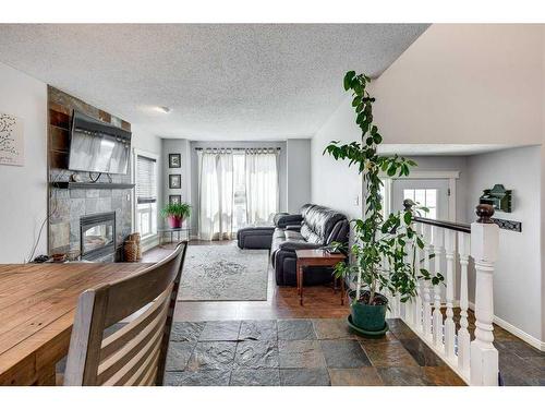 6002 44 Street Crescent, Innisfail, AB - Indoor Photo Showing Living Room With Fireplace