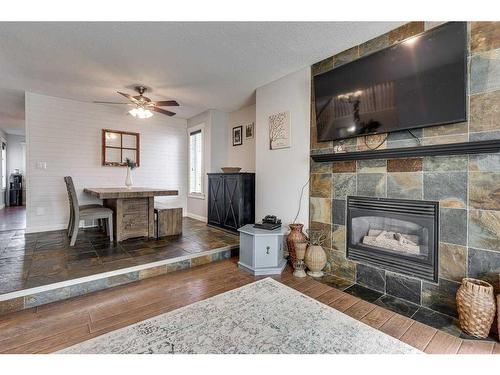 6002 44 Street Crescent, Innisfail, AB - Indoor Photo Showing Living Room With Fireplace