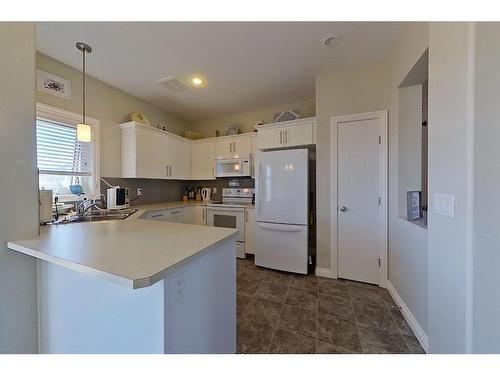 11 Crestview Boulevard, Sylvan Lake, AB - Indoor Photo Showing Kitchen With Double Sink