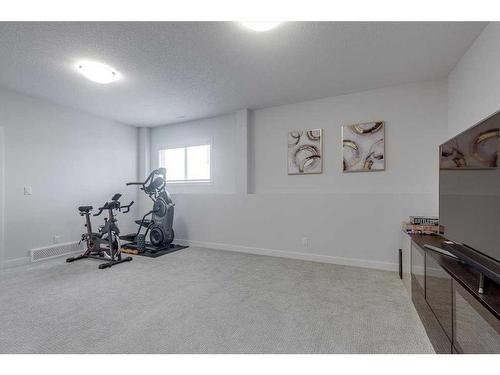 73 Longmire Close, Red Deer, AB - Indoor Photo Showing Gym Room