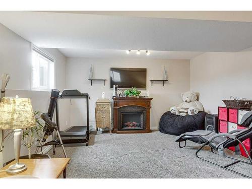 5207 48 Street Close, Innisfail, AB - Indoor With Fireplace