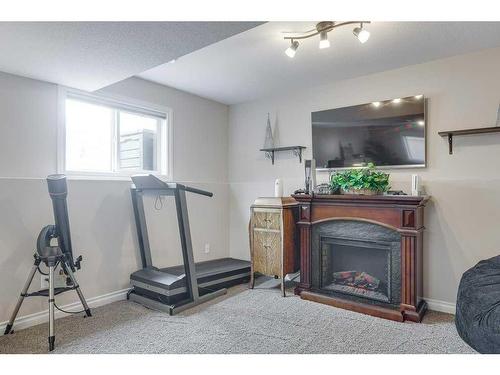 5207 48 Street Close, Innisfail, AB - Indoor Photo Showing Gym Room