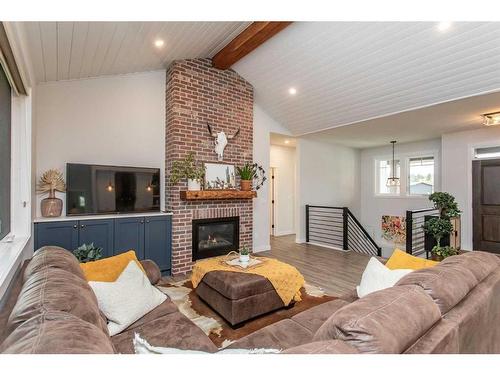 140-27111 Highway 597 Road, Rural Lacombe County, AB - Indoor Photo Showing Living Room With Fireplace