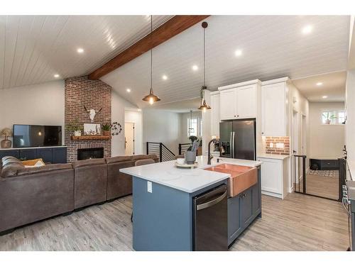 140-27111 Highway 597 Road, Rural Lacombe County, AB - Indoor Photo Showing Kitchen With Fireplace With Upgraded Kitchen