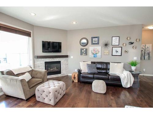 93 Connaught Crescent, Red Deer, AB - Indoor Photo Showing Living Room With Fireplace