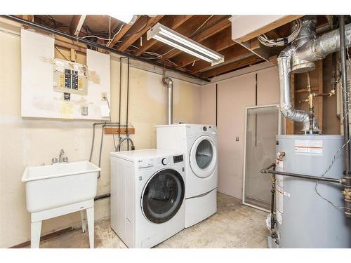 5103 49 Street, Clive, AB - Indoor Photo Showing Laundry Room