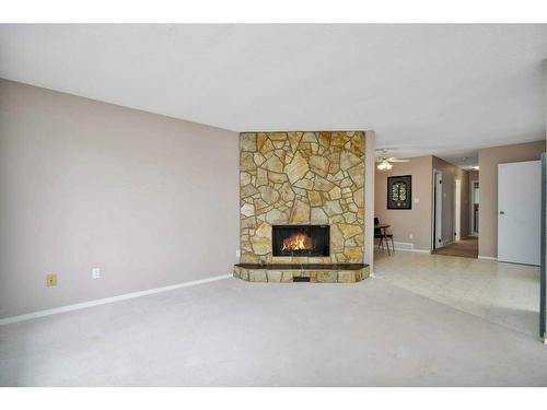 60 Boyce Street, Red Deer, AB - Indoor Photo Showing Living Room With Fireplace