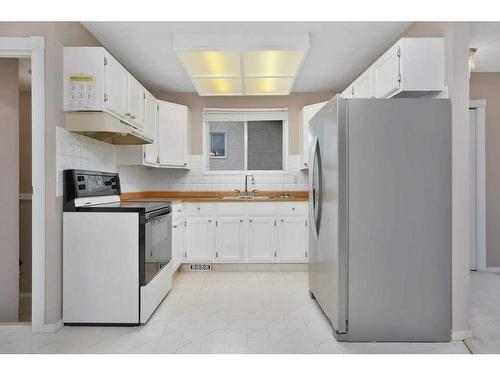 60 Boyce Street, Red Deer, AB - Indoor Photo Showing Kitchen With Double Sink