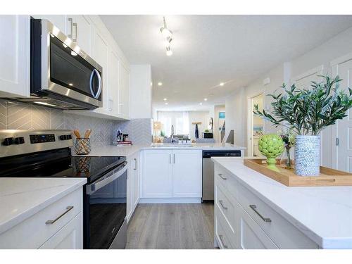 201 Vantage Drive, Cochrane, AB - Indoor Photo Showing Kitchen With Stainless Steel Kitchen With Upgraded Kitchen