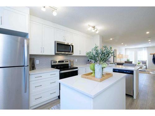 201 Vantage Drive, Cochrane, AB - Indoor Photo Showing Kitchen With Stainless Steel Kitchen With Upgraded Kitchen