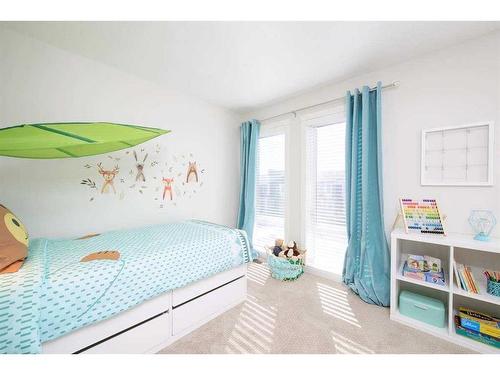 201 Vantage Drive, Cochrane, AB - Indoor Photo Showing Bedroom